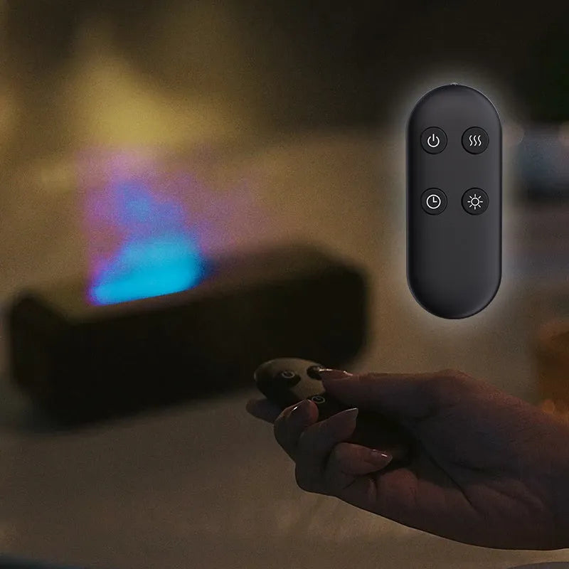 Black Flame Dynamic essential oil aroma diffuser with remote control on a wooden table, showing colour-changing LED lights.