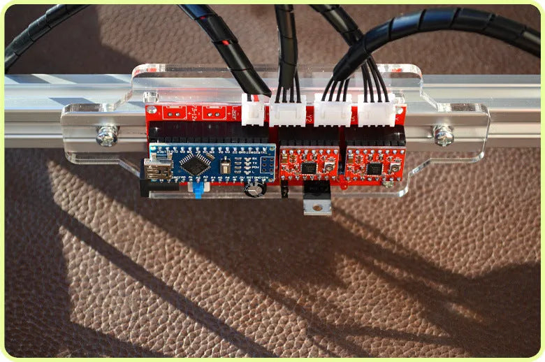 Miniature desktop laser engraving machine for marking and lettering with a 400mm x 300mm base plate.