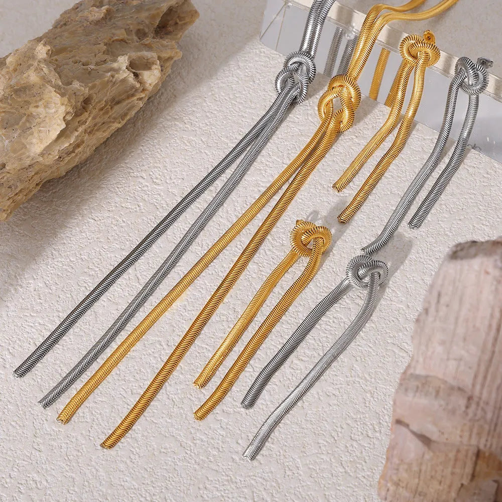 Gold knotted tassel pendant on titanium steel snake chain necklace with matching earrings