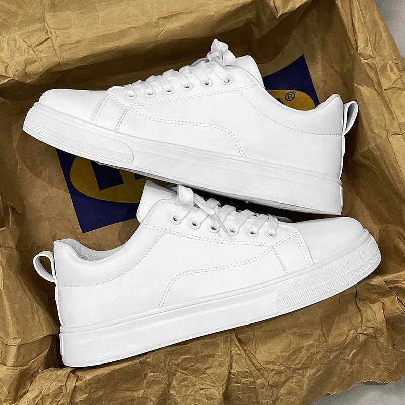 Men's low-top casual sneakers in white, black, or black with white sole, showing round toe and flat rubber sole.
