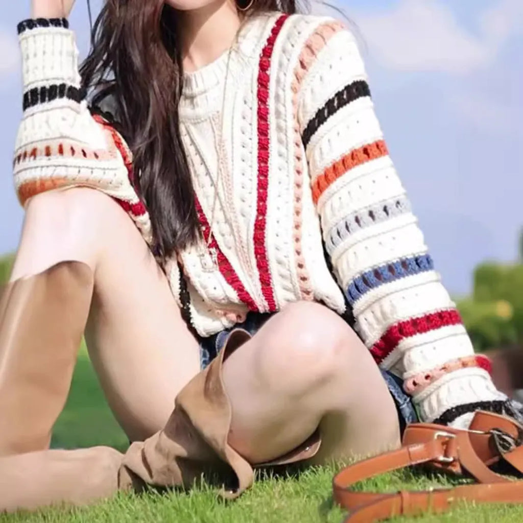 Colourful rainbow striped pullover sweater with batwing sleeves and hollow knit texture