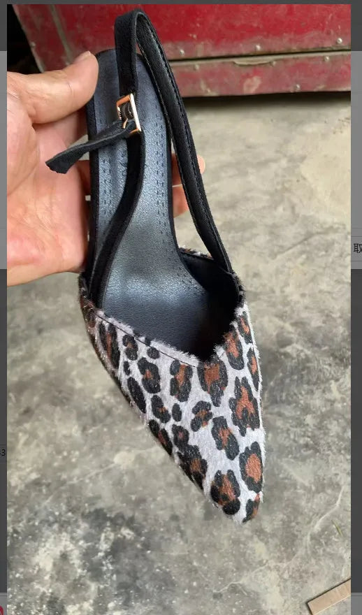 Scattered pointed toe women's sandals in leopard print suede, high heel style.