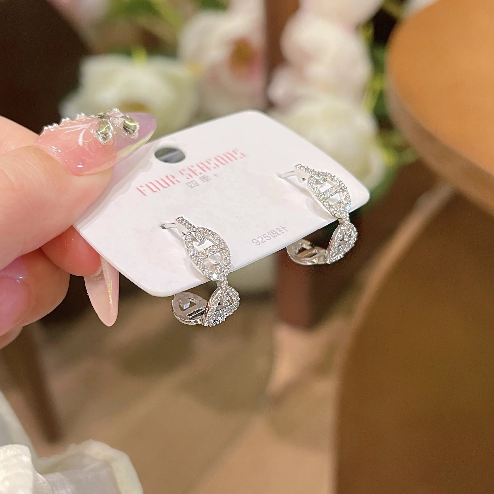 Women's diamond design electroplated earrings in silver, gold, and rose gold colour variations