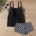 Women's high-waist polka dot boxer swimsuit briefs in polyester fabric on a mannequin.