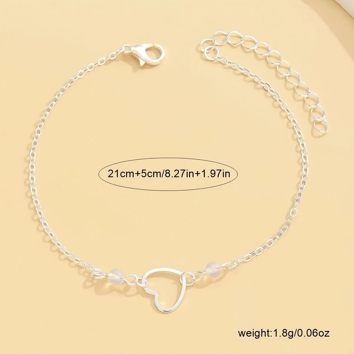 Adjustable women's anklet with heart-shaped geometric pendant in gold or silver alloy metal