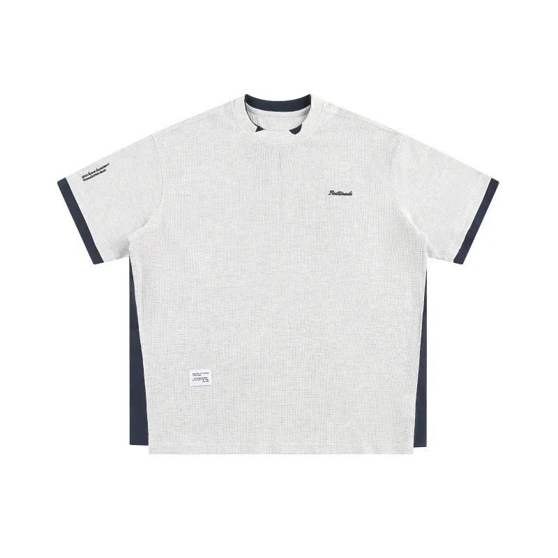 Retro alphabet embroidered waffle knit T-shirt in loose fit, shown in navy blue.