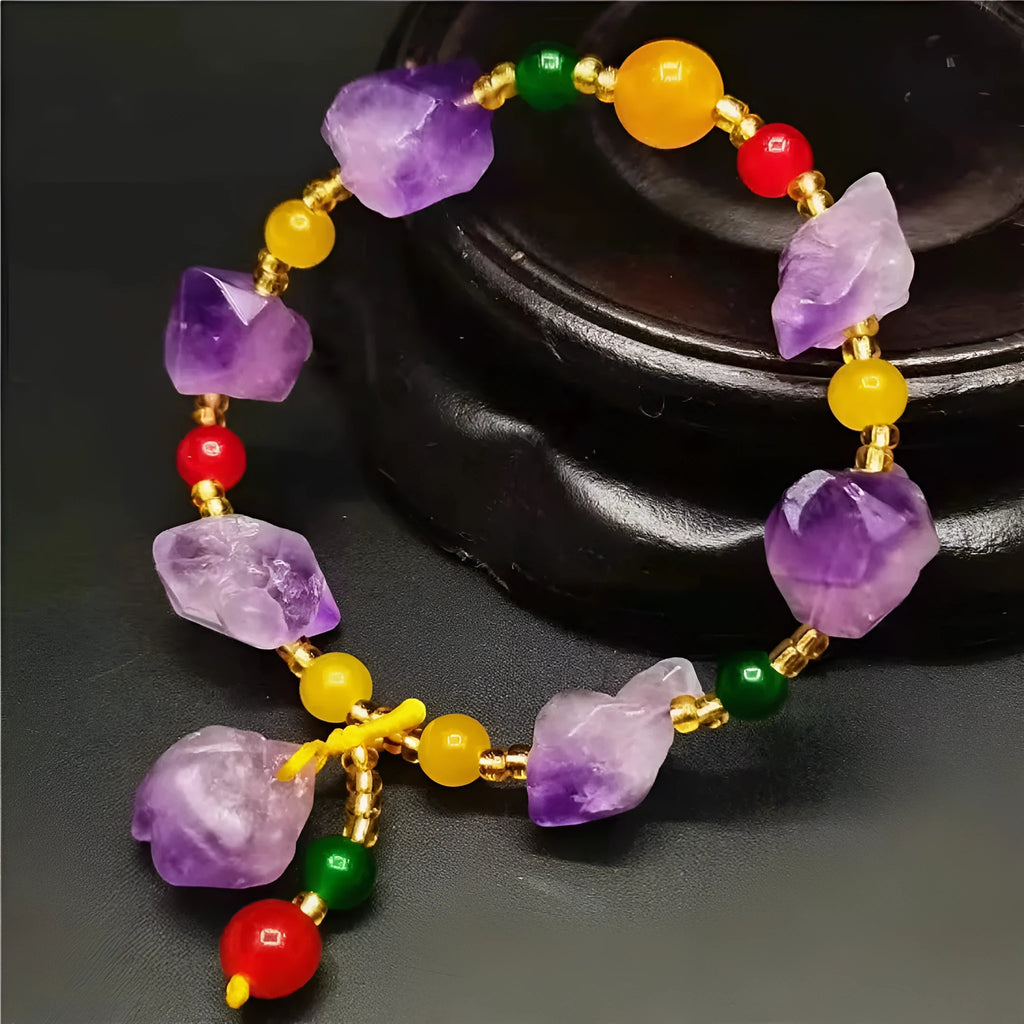 Natural shaped purple amethyst bead bracelet for women with a fu charm.