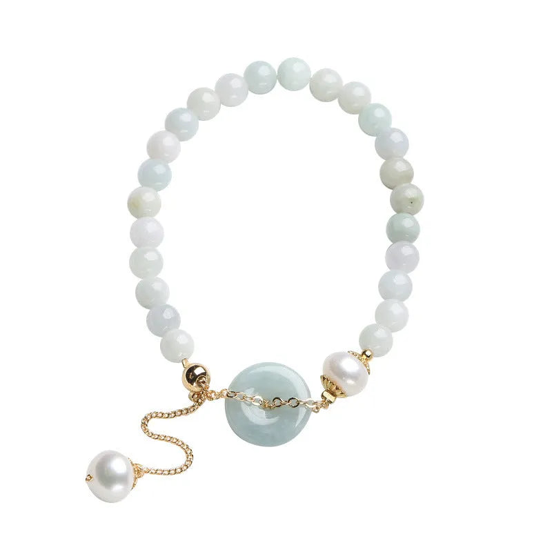 Natural emerald green jade and pearl bracelet with geometric peace buckle closure