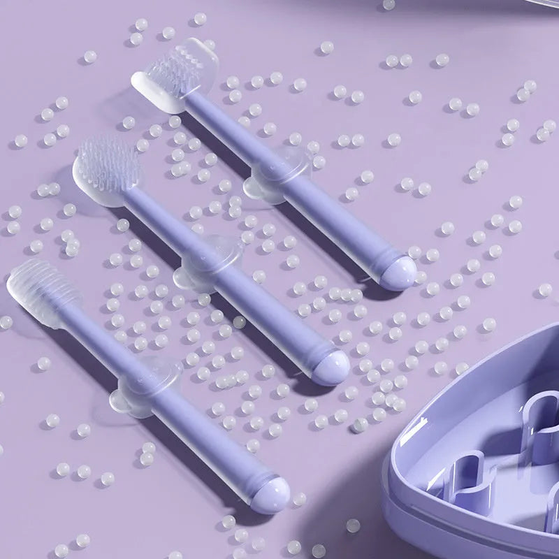 Blue, green, and purple silicone pet toothbrushes for dog and cat dental cleaning.
