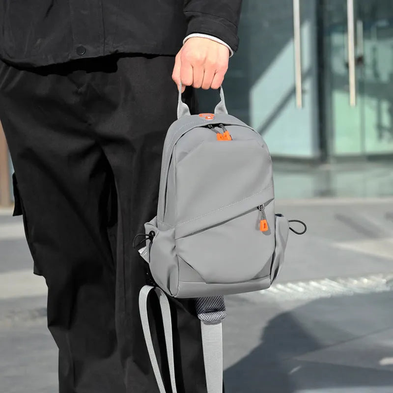 Men's black polyester crossbody bag with simple design and waterproof features