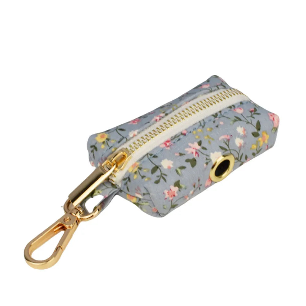 Blue floral patterned cloth dog collar set with matching leash, bow, and vest for small to extra-large dogs.