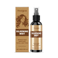 100ml bottle of hair care spray with ginger and rosemary extracts on a white background.