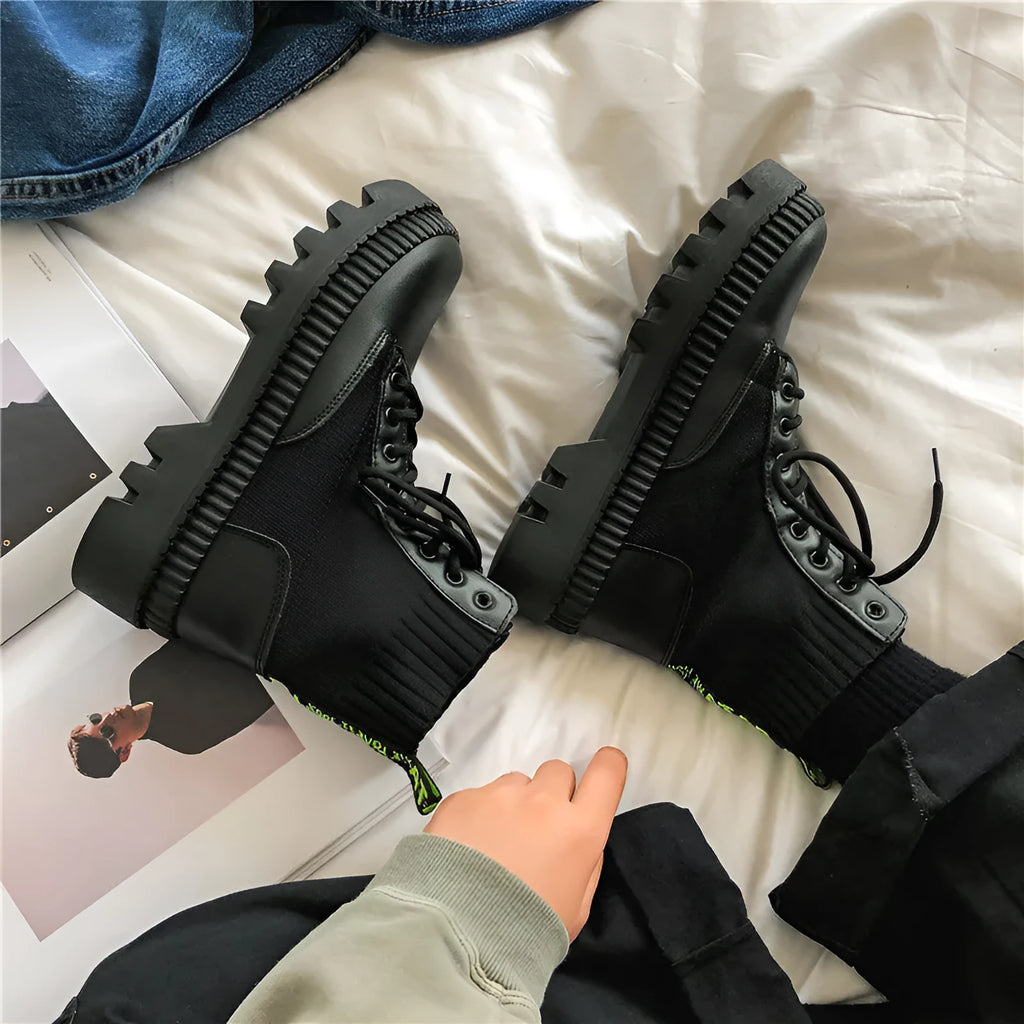 Men's black leather platform Doc Martens boots with side zipper and lace-up high-top design