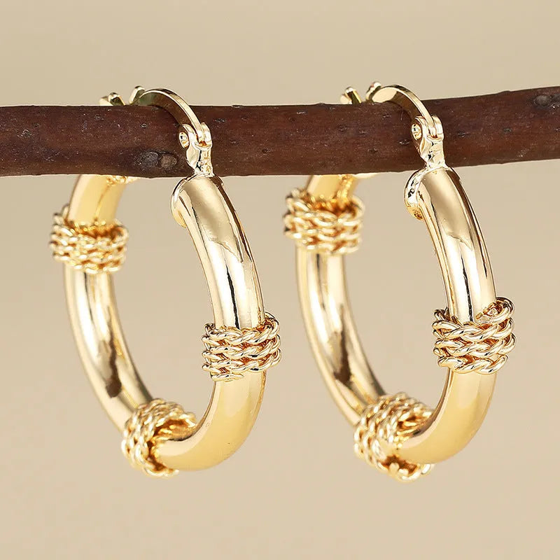 Geometric copper ring ear clips for women in golden colour with linear design elements