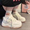 Women's green platform sneakers with patent leather finish and round toe front lace-up design