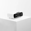 Compact white ABS acrylic 3-in-1 unit combining a Bluetooth speaker, wireless charger, and night light.