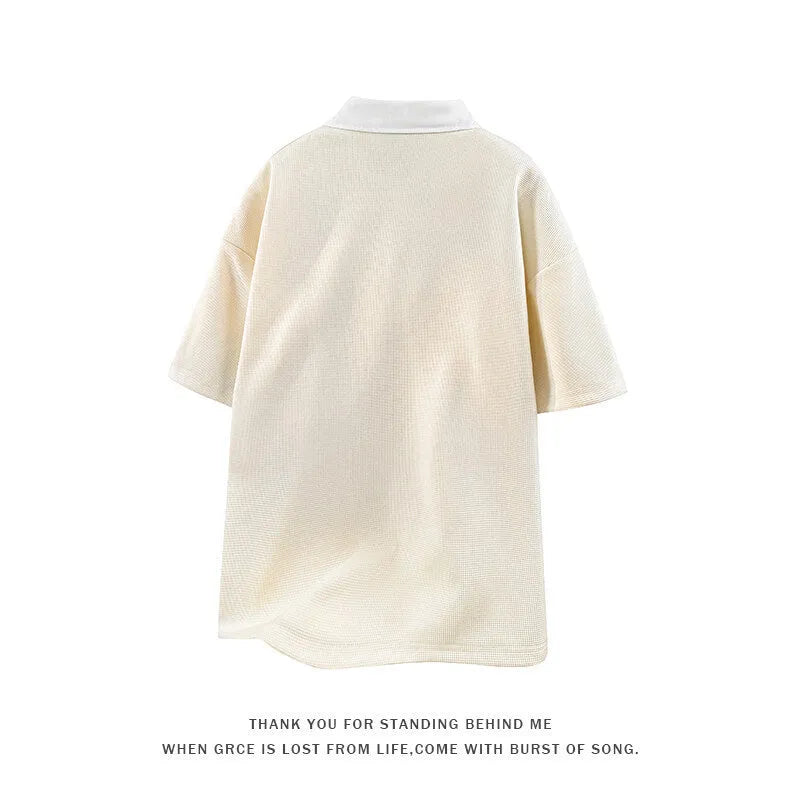 Men's apricot and black heavy Henry collar short sleeve polo sweater made from thin spandex fabric.