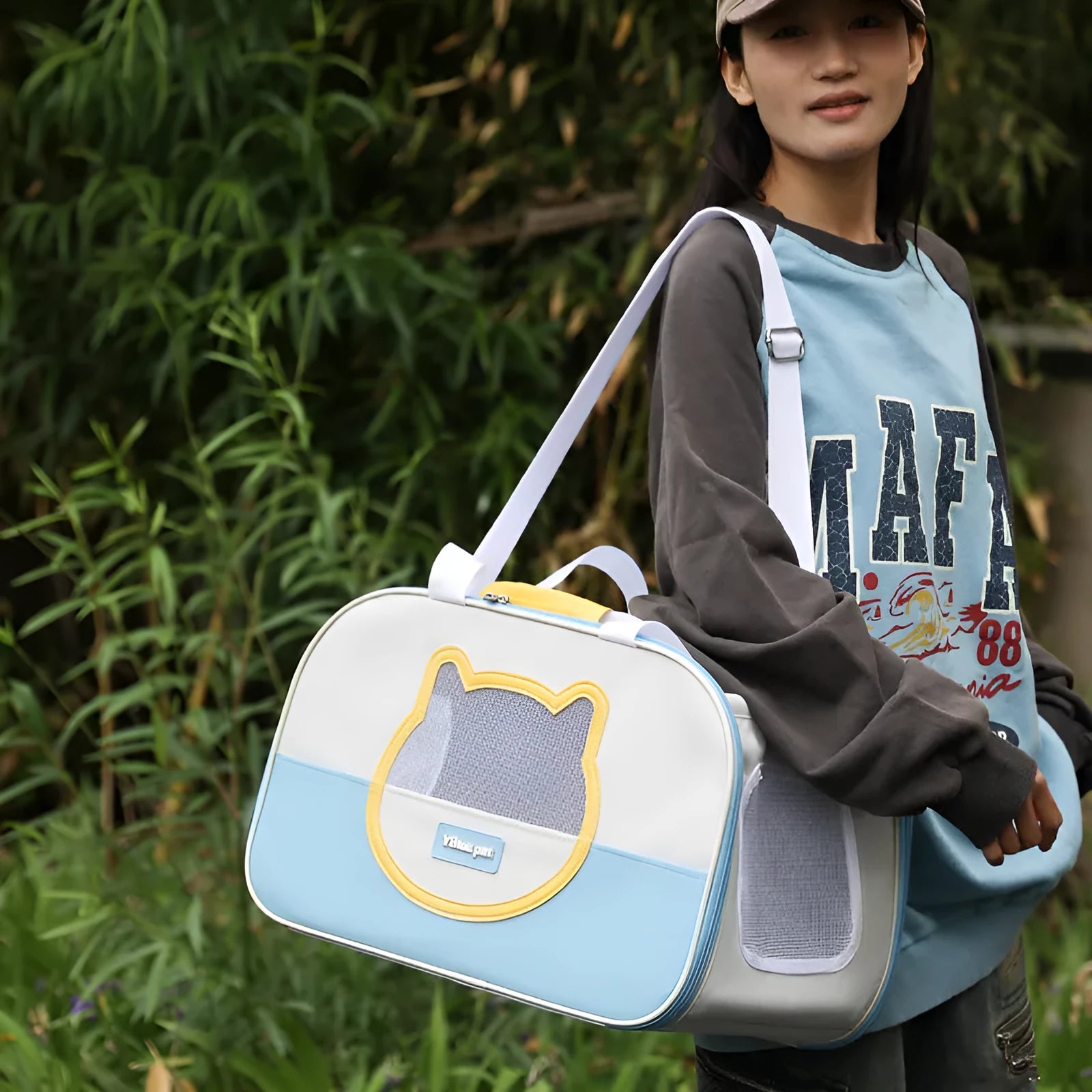 Blue outdoor portable foldable cat backpack with mesh panels, shown with a cat inside.