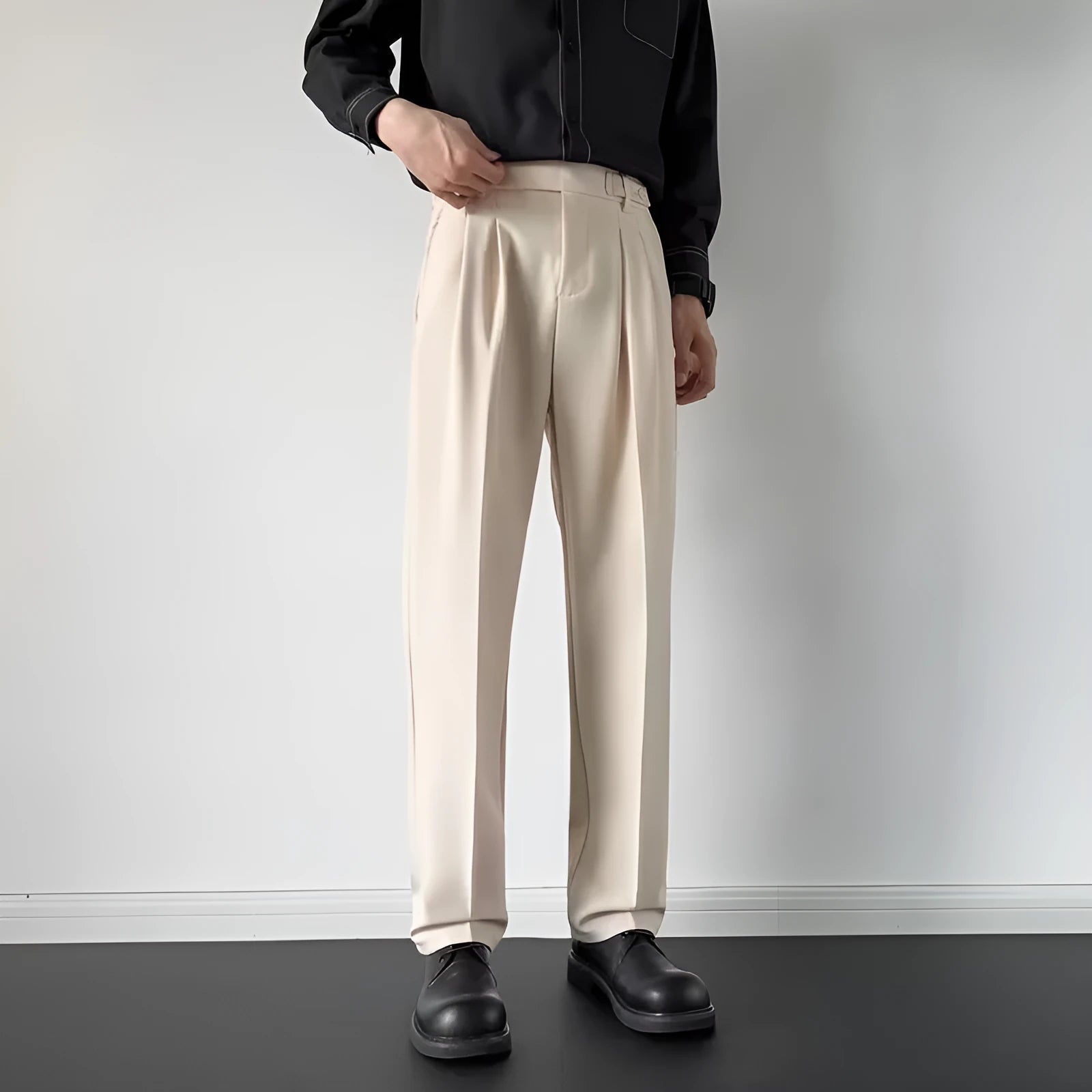 Men's straight loose fit suit trousers in apricot and black colours, made from polyester fabric.