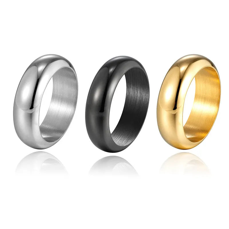 Glossy electroplated titanium steel ring shown in gold, black, and steel colour on a grey background.