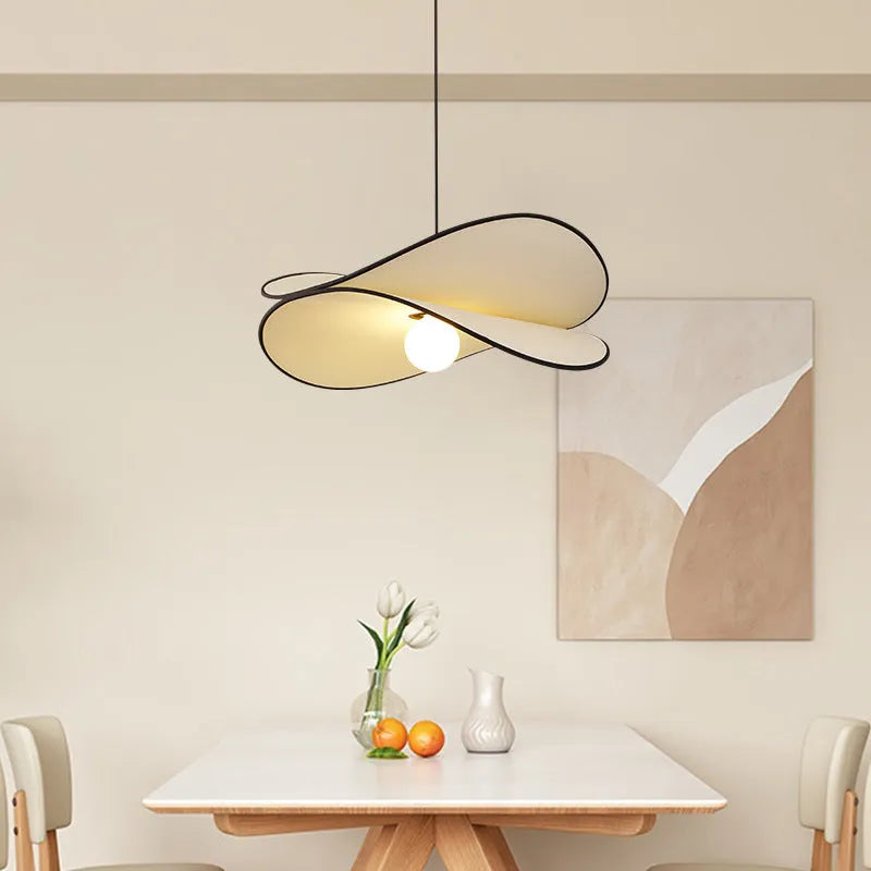 French artistic modern fabric potato chips chandelier pendant light in a bedroom setting.