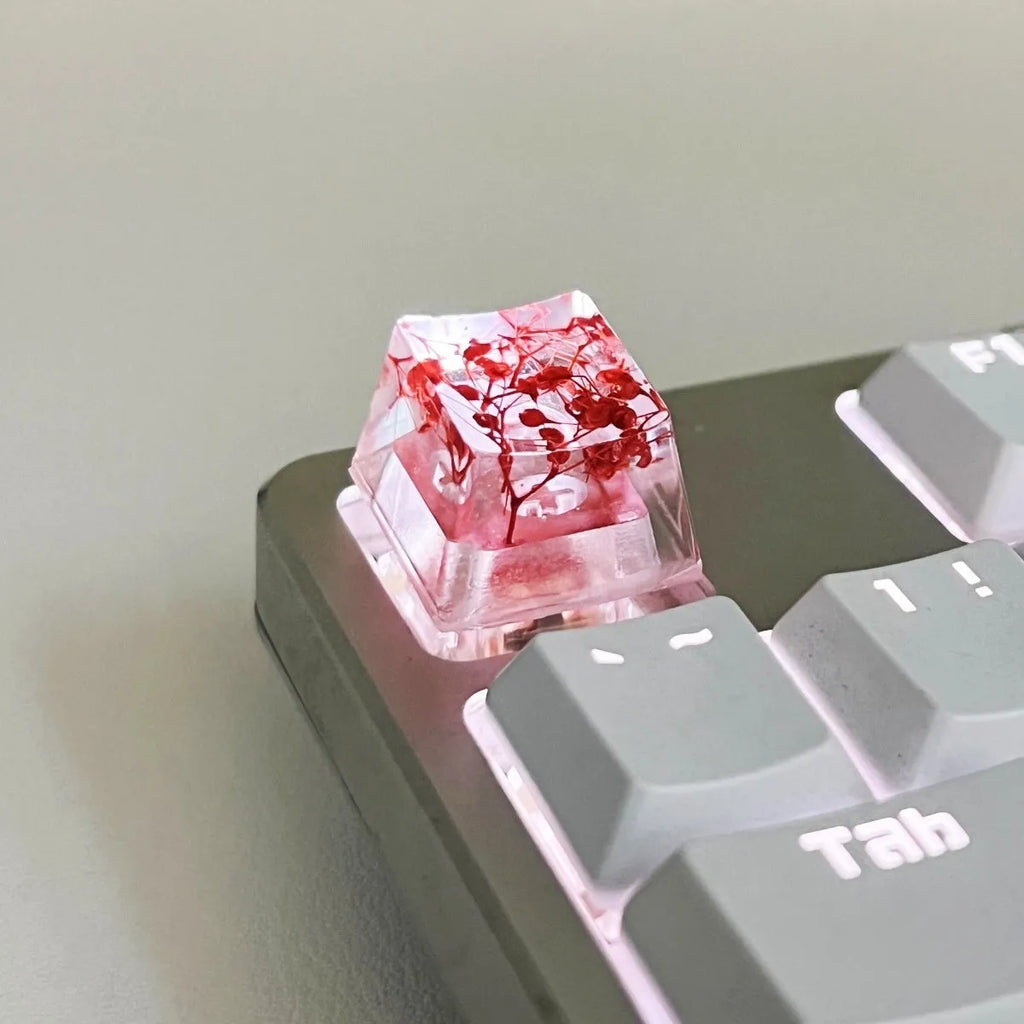 A high-transparency resin mechanical keyboard keycap with a starry sky design, shown in a choice of colours.