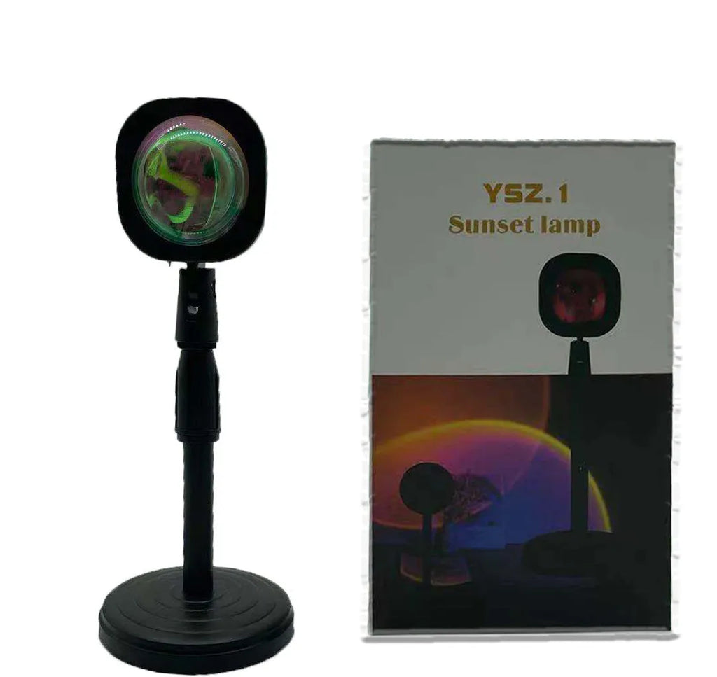 Rechargeable sunset red and rainbow projection lamp with USB cable and push-button switch.