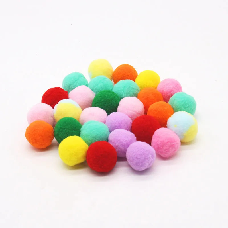 Pet toy set showing 30cm plush launcher gun and several soft 3cm yarn balls for dog fetch games