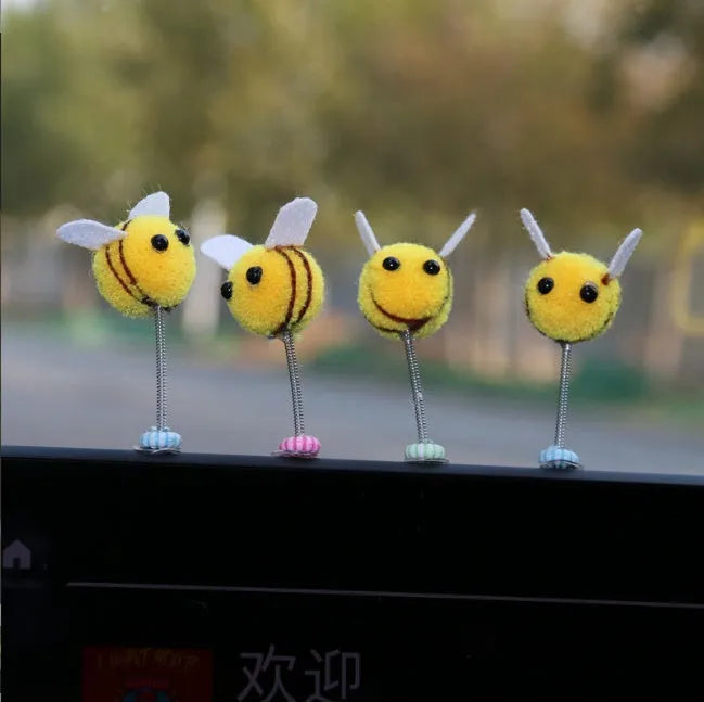 Yellow and black fur ball bee car decoration measuring 3x3 cm
