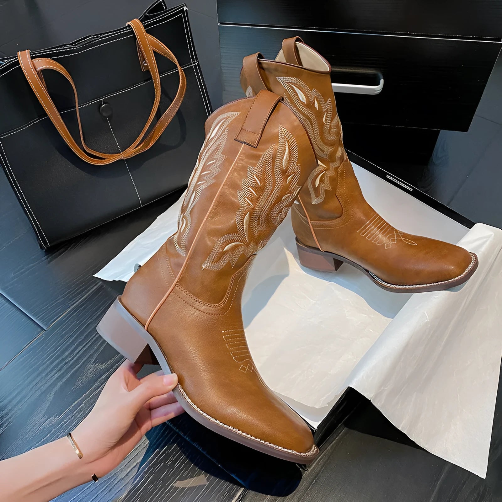 Brown embroidered women's mid-calf Martin boots on a waterproof platform with a square heel.
