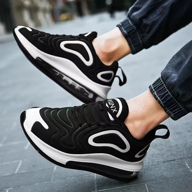 Men's black casual running sneakers with air cushion, lace-up front, and thick sole.