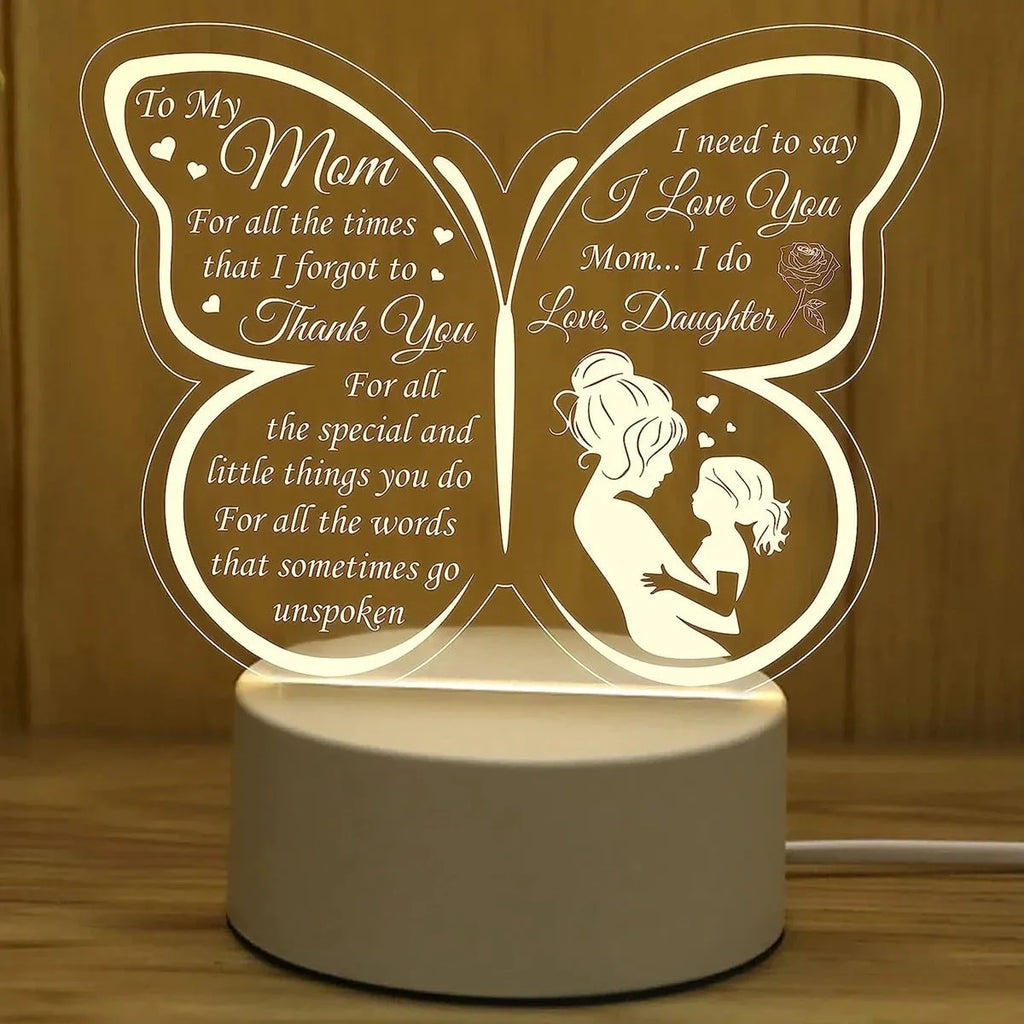 White heart-shaped acrylic table lamp with USB cable and touch control on a wooden surface
