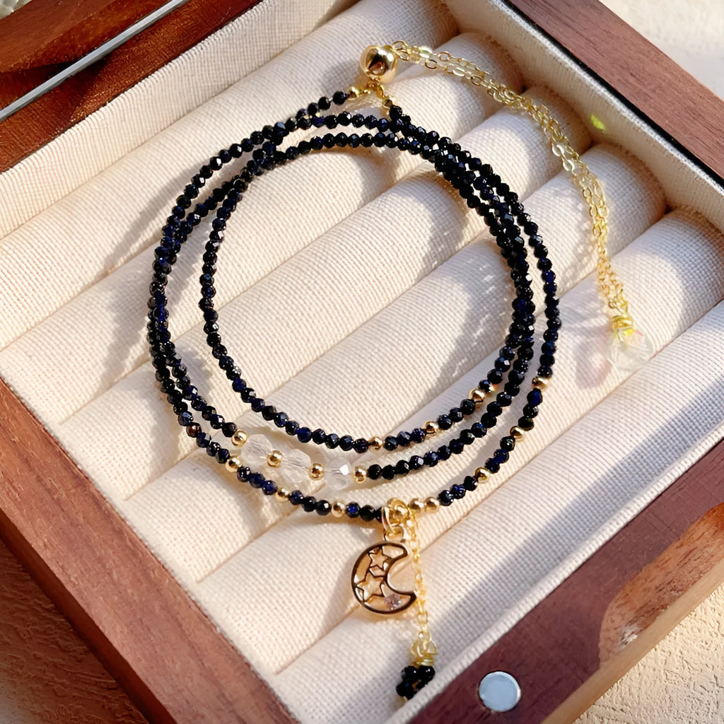 Blue sand stone cut three-ring bracelet with gold-tone metalwork, manual processing details visible