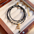Blue sand stone cut three-ring bracelet with gold-tone metalwork, manual processing details visible