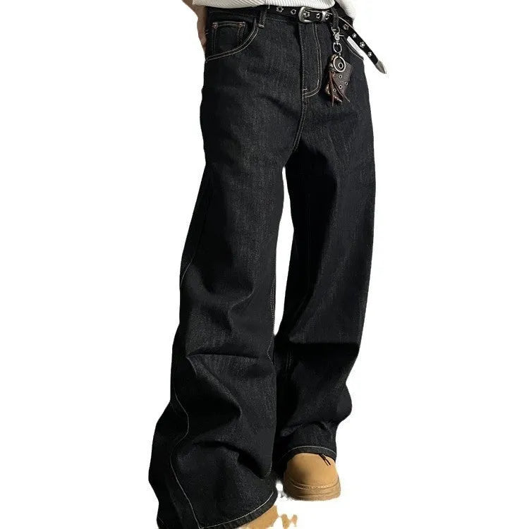 Black loose wide-leg retro jeans with a straight-leg cut and zip fly on a model.