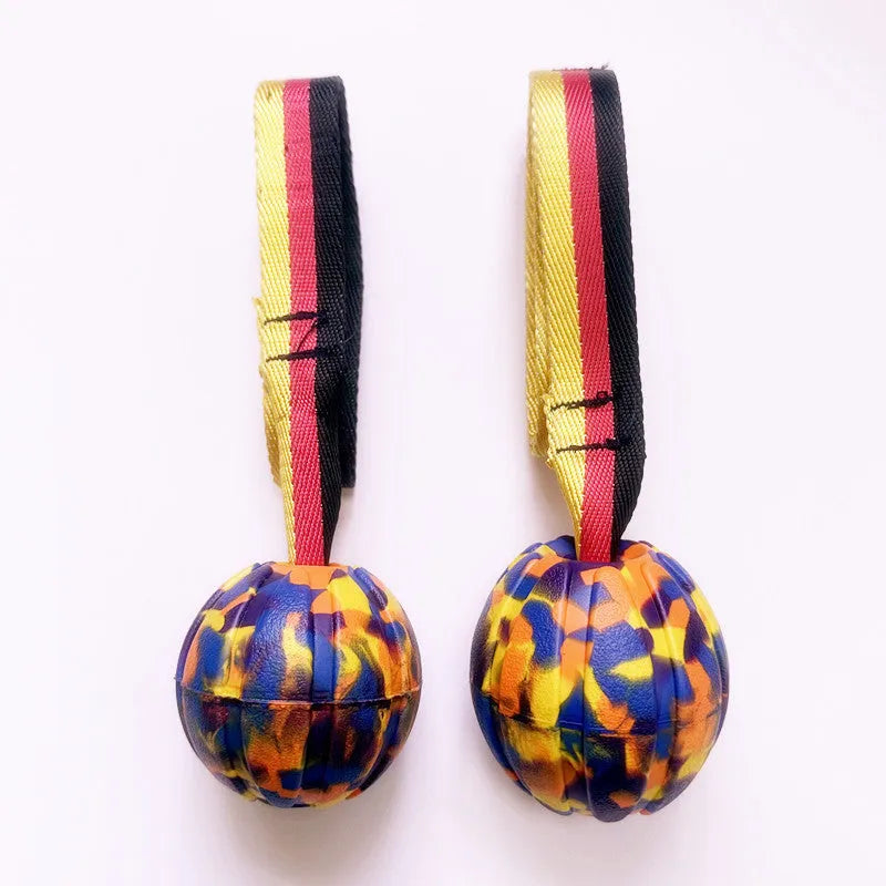 Floating EVA foam dog training ball in camouflage and yellow colours showing three size options