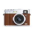 Black 5K digital camera with front and rear lenses, a 2.88-inch screen, and an optical viewfinder on top.