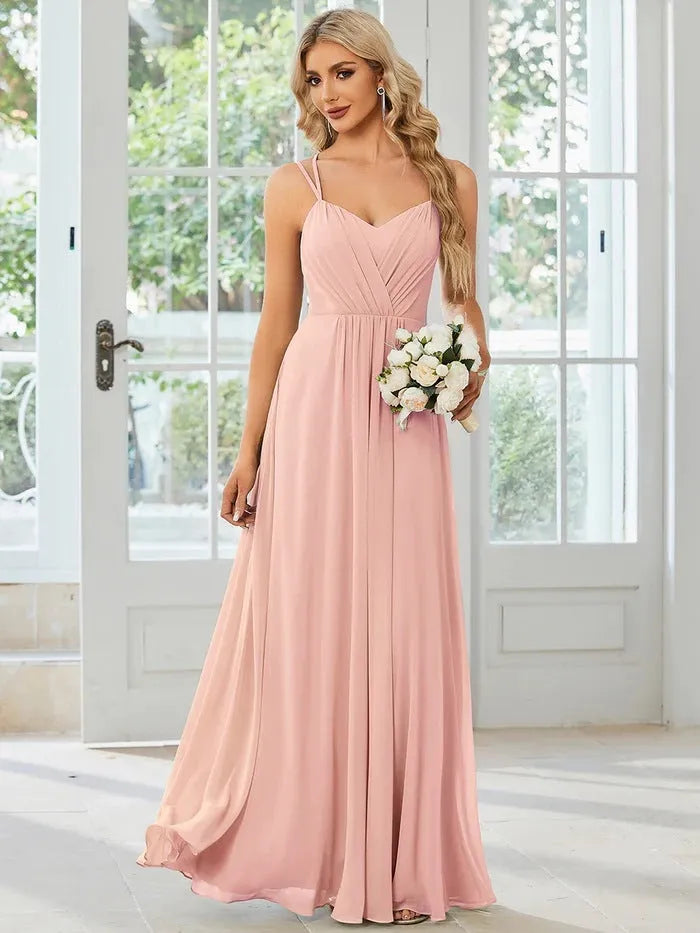 Women's sleeveless A-line pleated long dress in light green colour with sling neckline