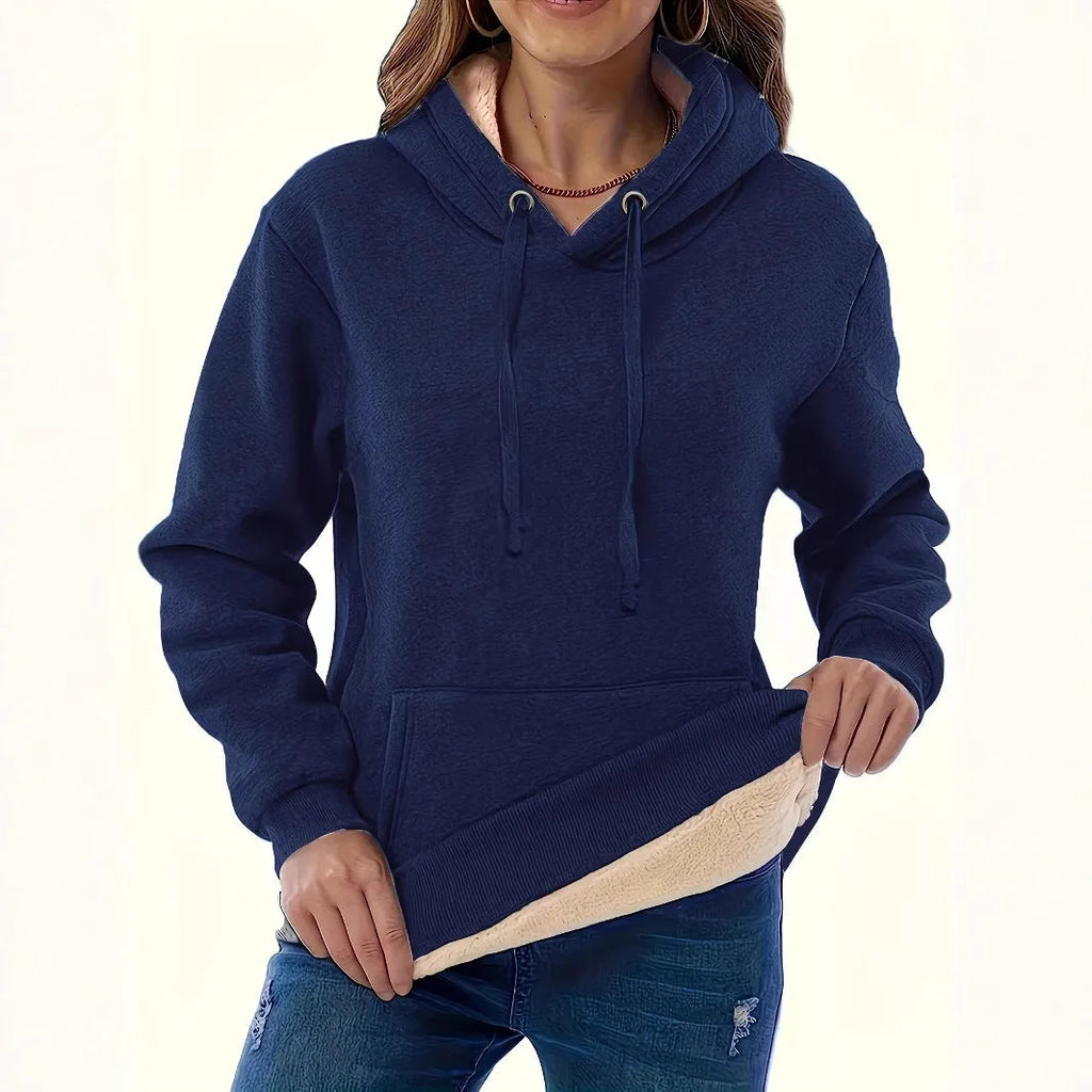 A woman's loose-fit hooded sweater with a raised 3D pattern, shown in a wine red colour.