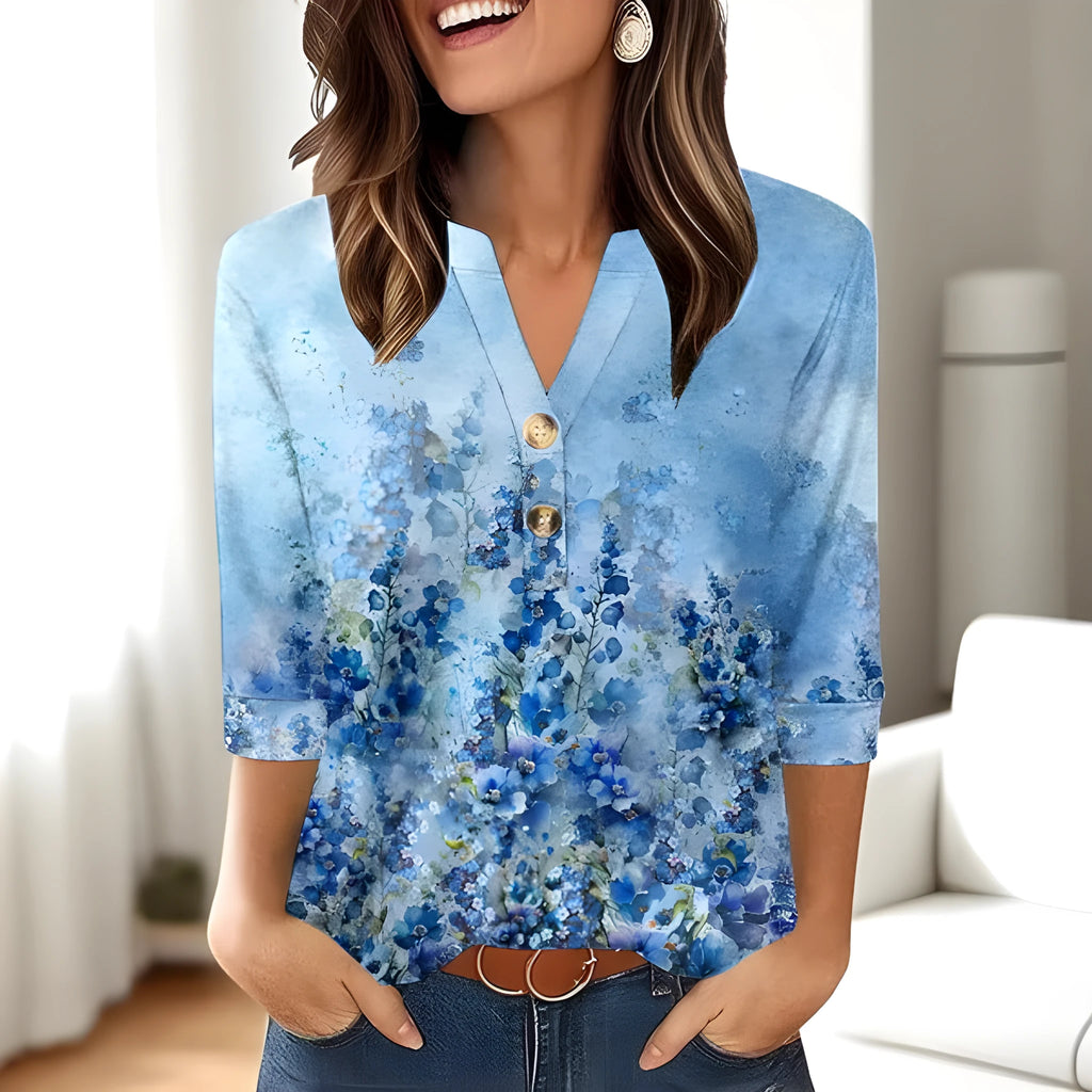 Women's loose fit V-neck top featuring a 3D printed pattern, shown in a colour option.