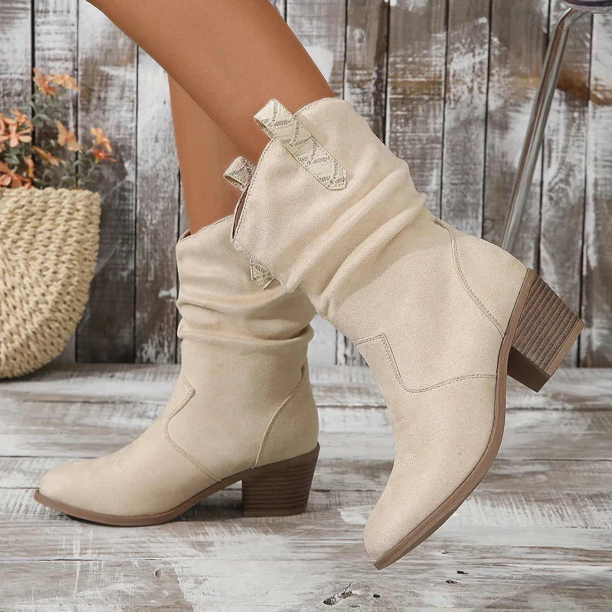 Women's suede mid calf boots with leather stitching detail and a short stout mid heel, shown in lotus root colour