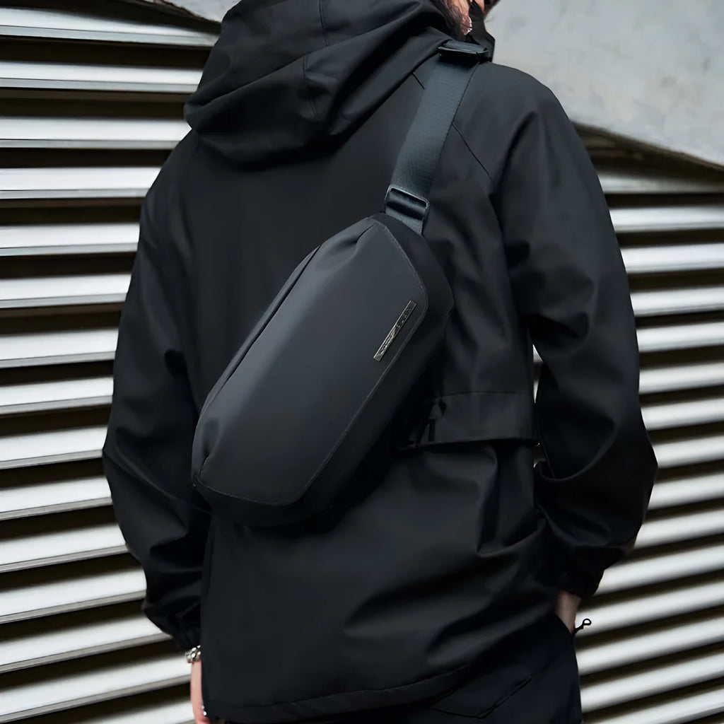 Black Oxford cloth men's messenger bag with cross-body strap and street style details