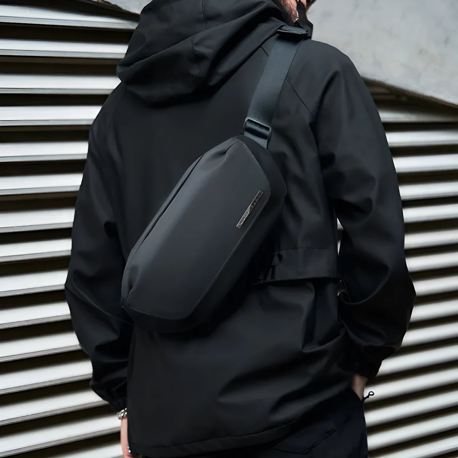 Black Oxford cloth men's messenger bag with cross-body strap and street style details