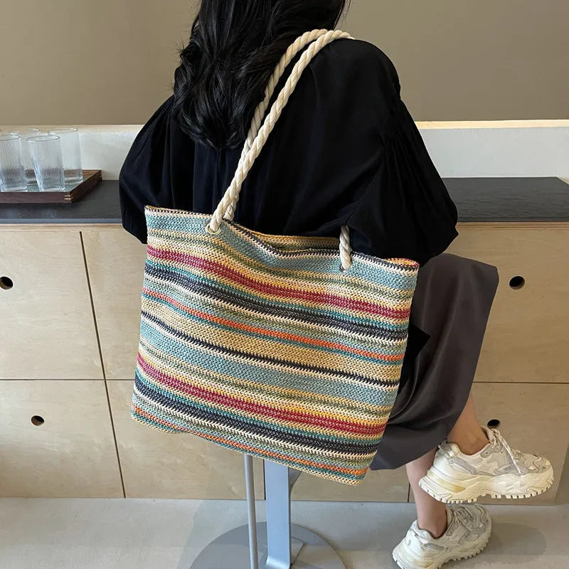 Blue straw woven single-shoulder bag with nylon construction and polyester lining.