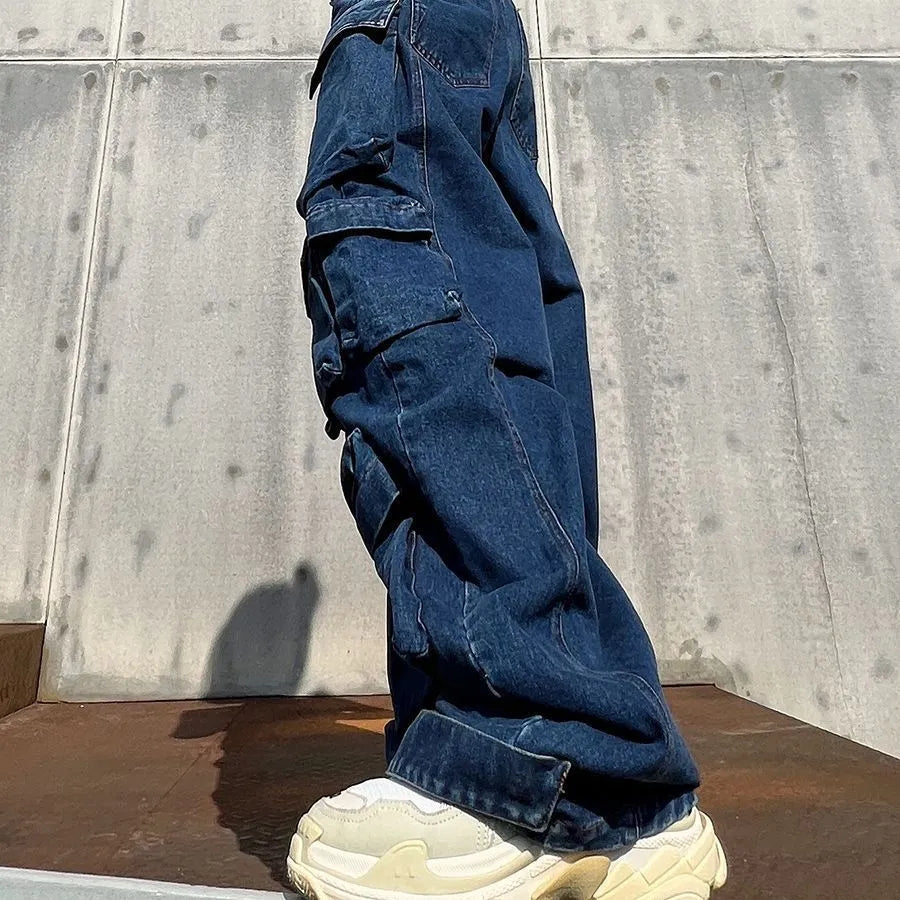 Dark blue distressed wide-leg jeans with high waist and multiple pockets on cotton denim fabric