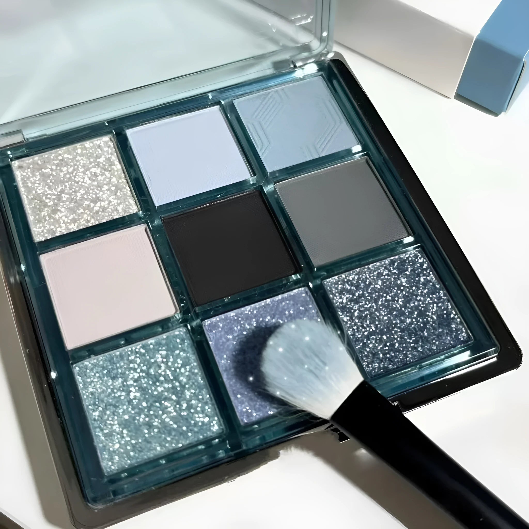 MUGELEEN nine-colour eye shadow palette showing low saturation shades with matte and shimmer finishes