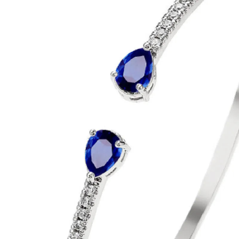 Copper bracelet with zircon inlay treatment in blue colour option