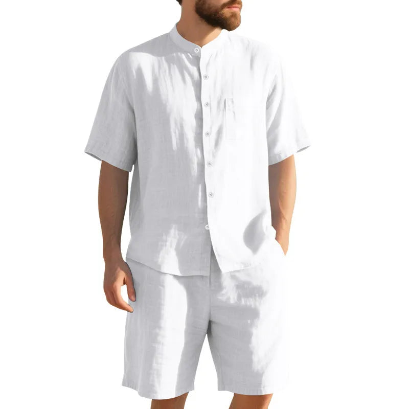 Man wearing a light-coloured short sleeve linen shirt and matching shorts from a casual summer suit set.