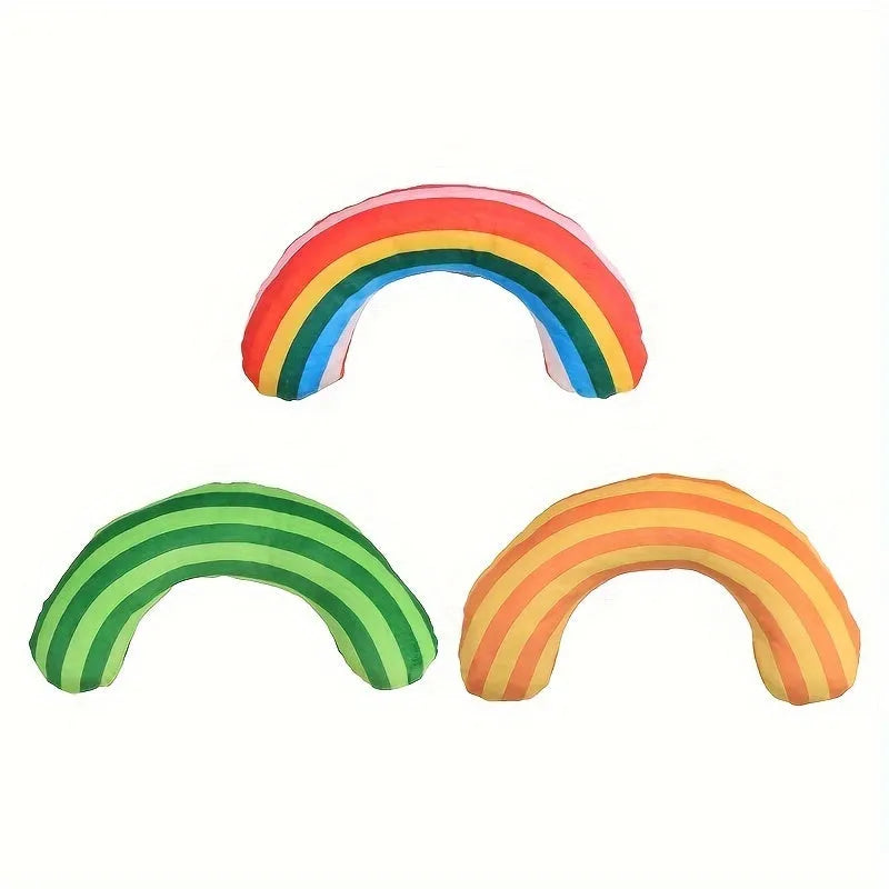 Green, rainbow, and yellow cat toy set with noise maker, catnip strip, and striped plush pillow.