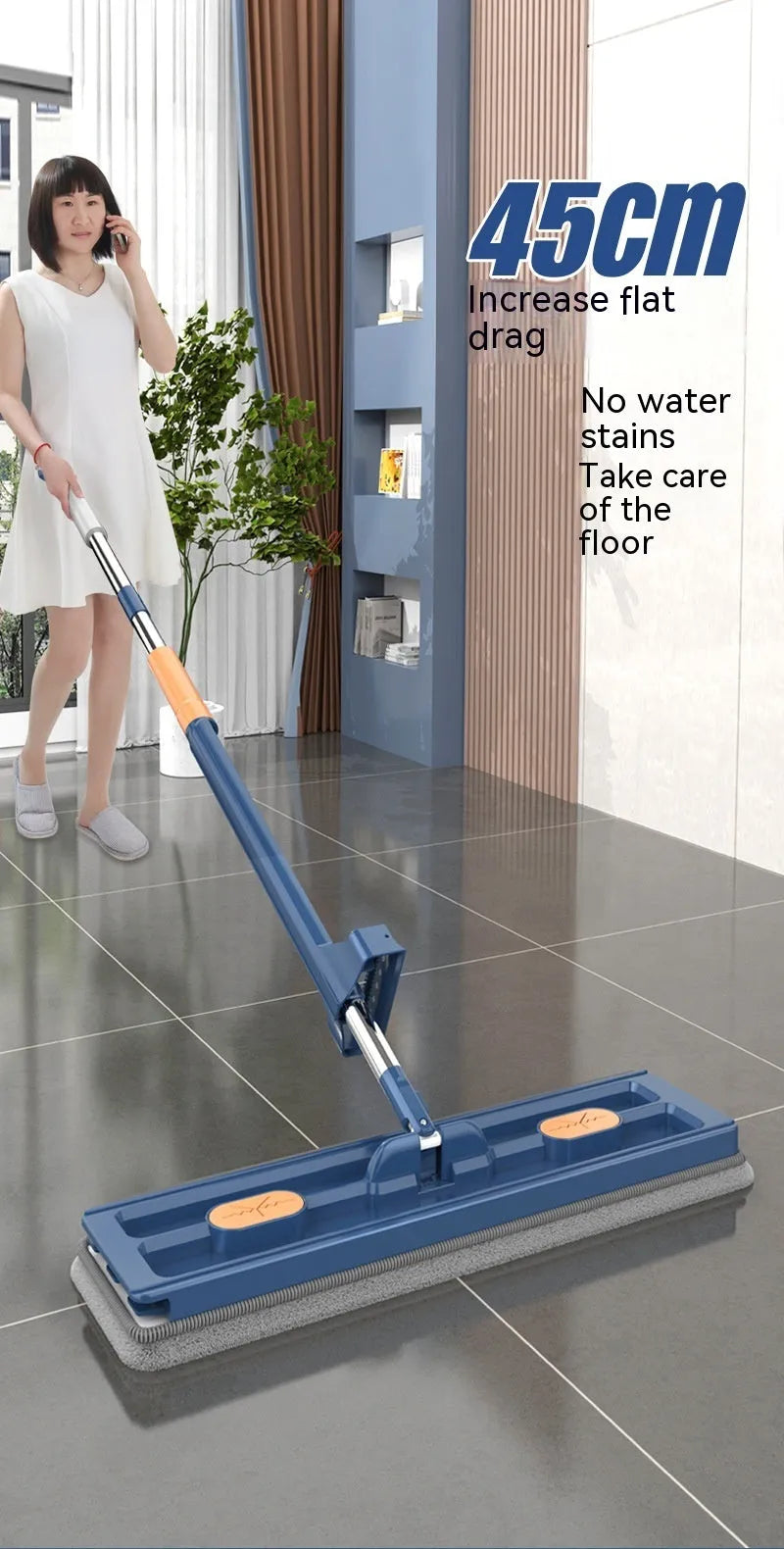 Large blue and white flat mop with a long stainless steel handle and a 360-degree rotating head on a hard floor.